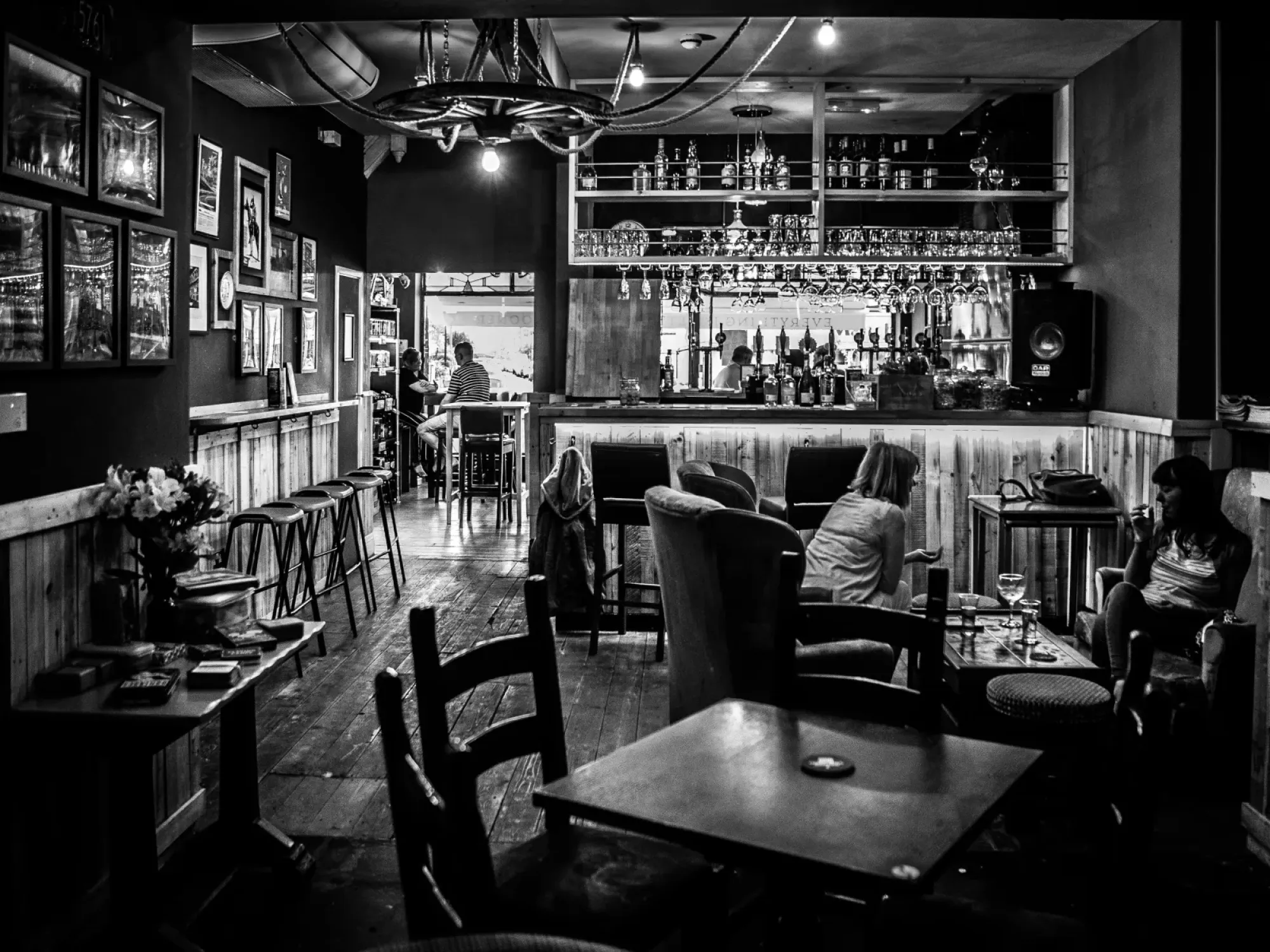The bar and seating inside Prairie Schooner Taphouse, a micropub and off-licence in Urmston, Trafford