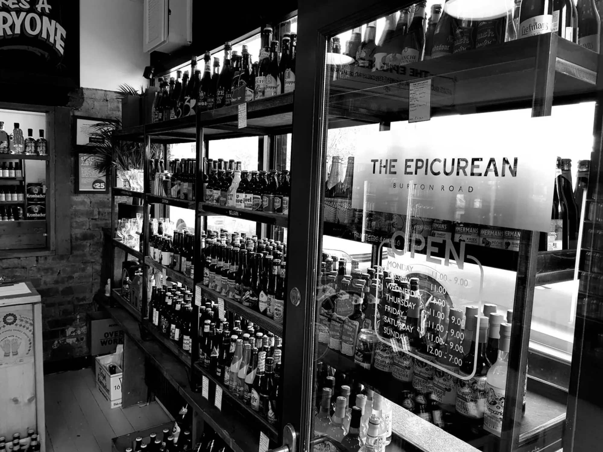 Fridges of craft beer inside The Epicurean, a beer shop in West Didsbury