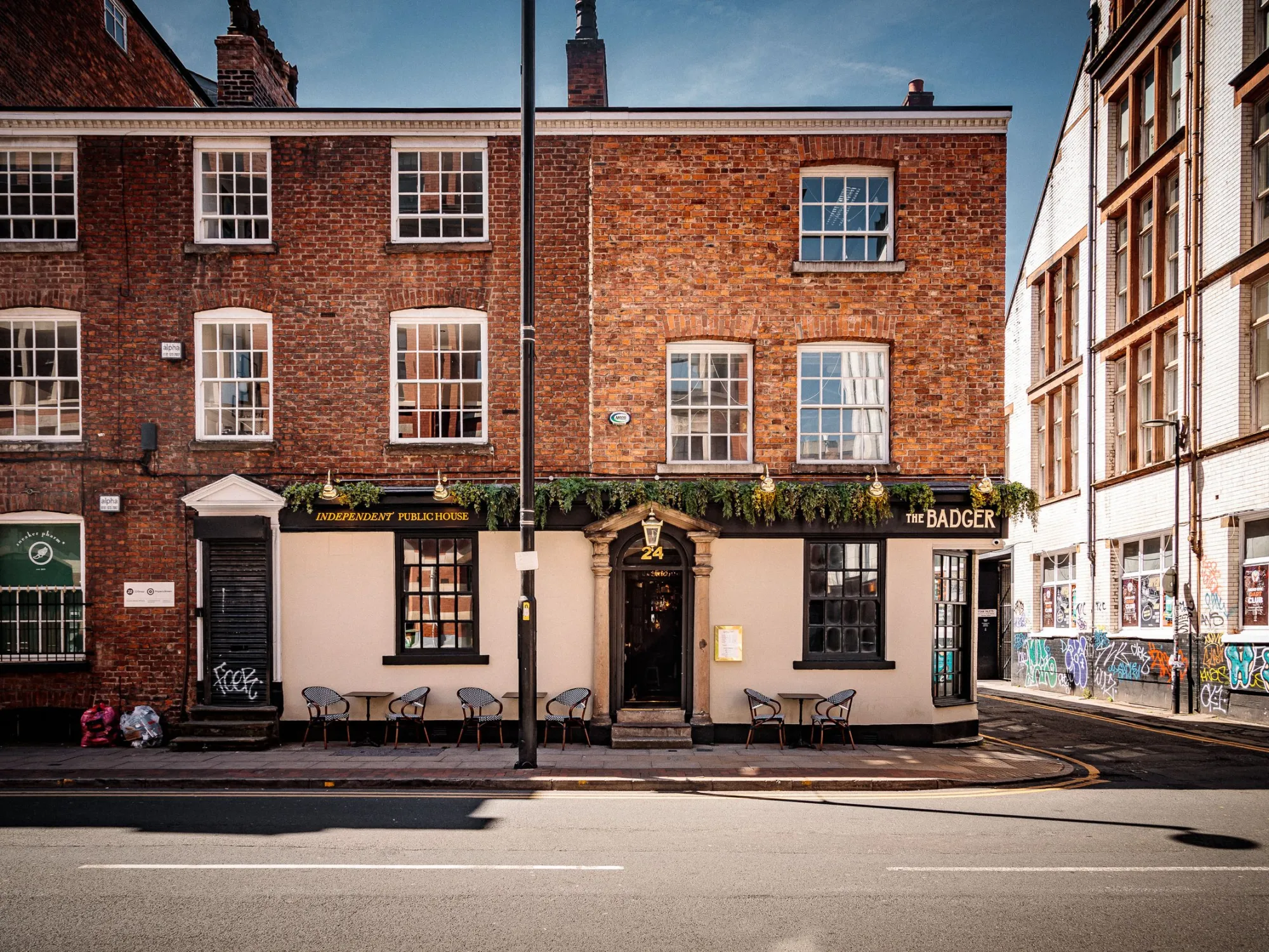 The Badger on Dale Street, a cream-fronted corner pub with tables outside, a pub in the Northern Quarter, Manchester